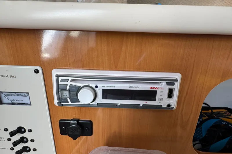 Slide: The Image of Control panel of a 2002 Bayliner 2455 Ciera boat with audio system. - 13