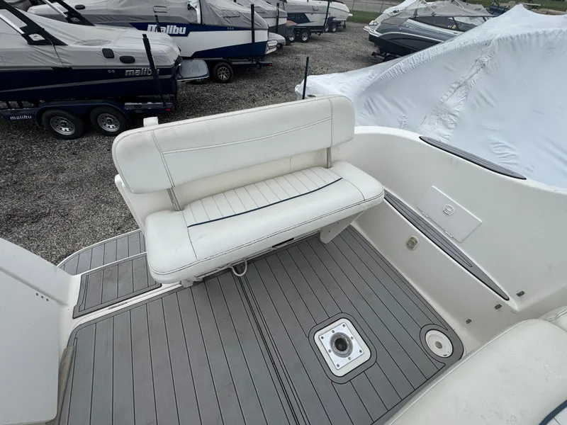 Slide: The Image of 2002 Bayliner 2455 Ciera boat interior with white seating and gray deck. - 20