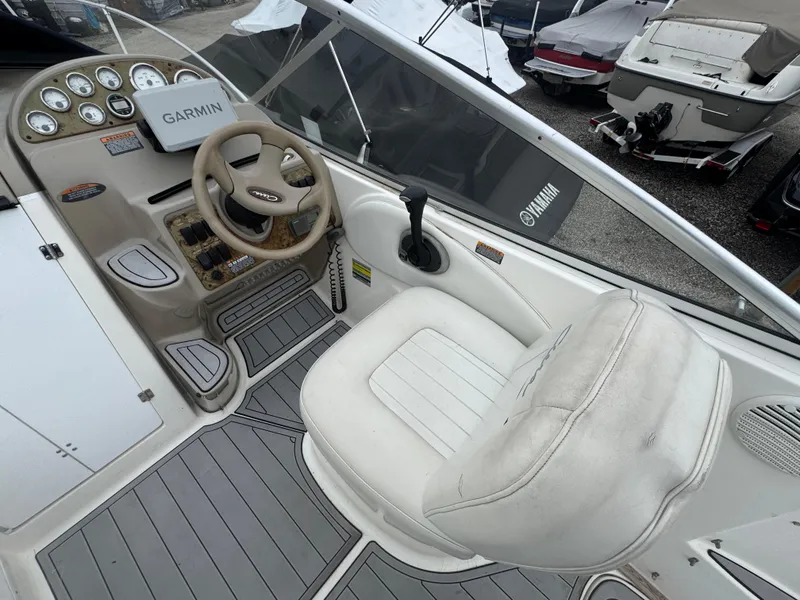 Slide: The Image of 2002 Bayliner 2455 Ciera cockpit with Garmin navigation and Yamaha controls. - 23