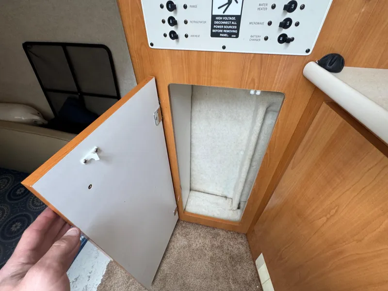Slide: The Image of Open storage compartment in 2002 Bayliner 2455 Ciera boat interior. - 34