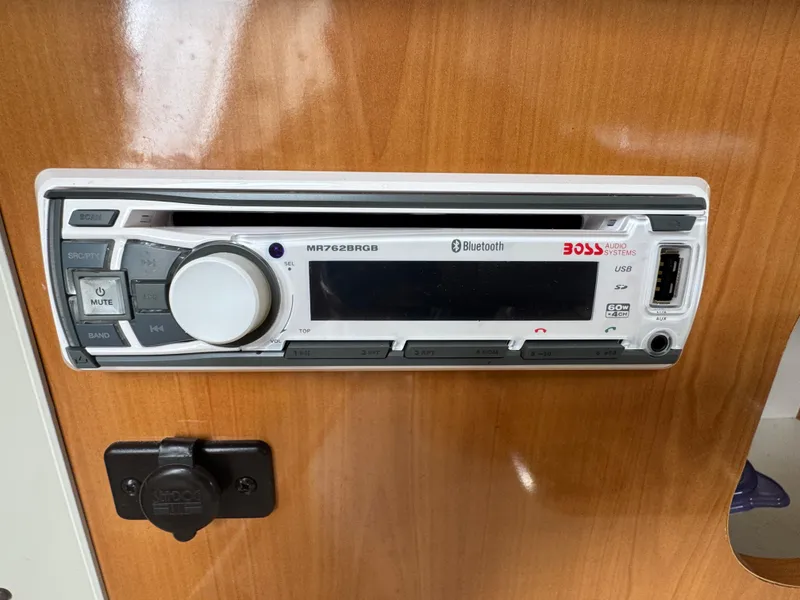 Slide: The Image of Boat stereo system on 2002 Bayliner 2455 Ciera, featuring Bluetooth and USB connectivity. - 36