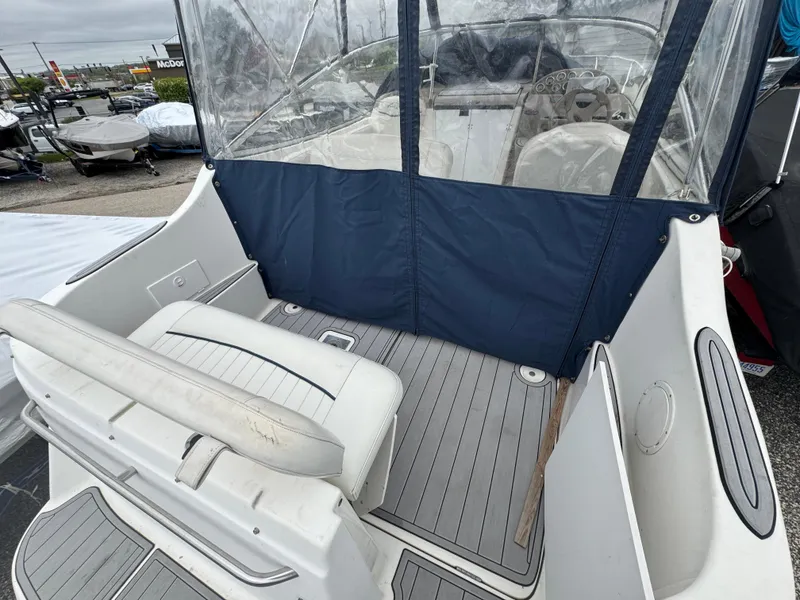 Slide: The Image of 2002 Bayliner 2455 Ciera boat interior with seating and clear canopy. - 40