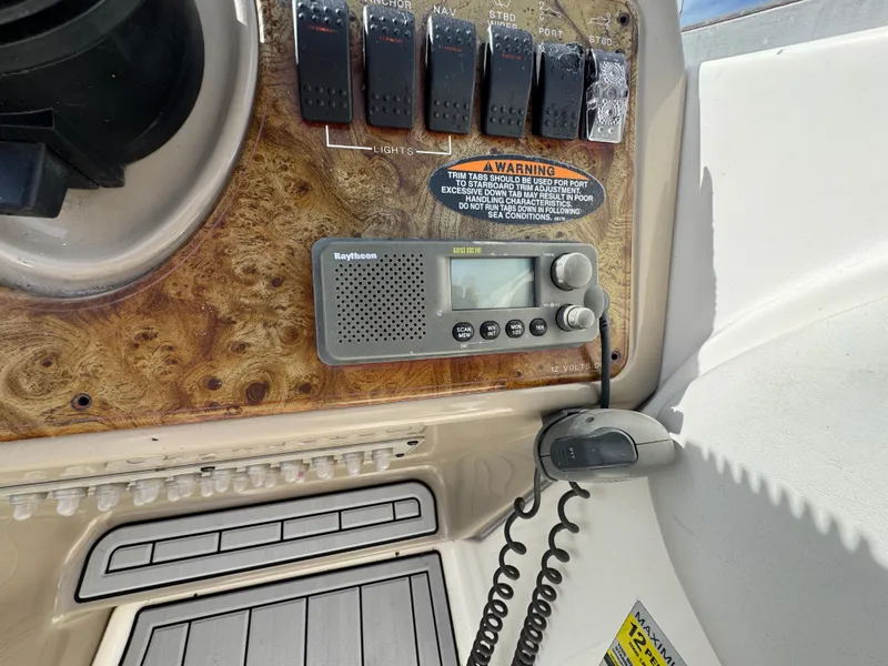 Slide: The Image of Control panel of a 2002 Bayliner 2455 Ciera boat with radio and switches. - 5