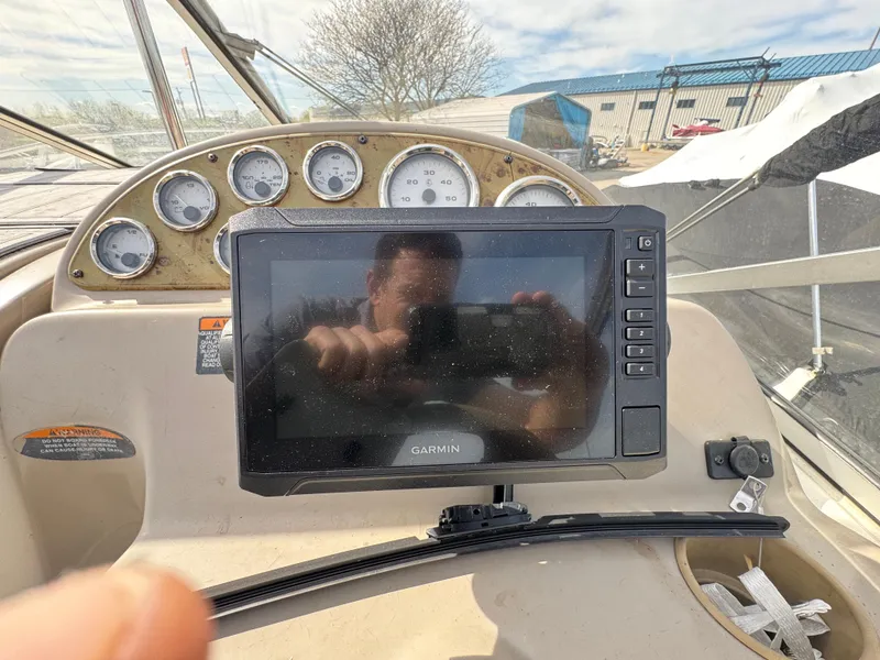 Slide: The Image of 2002 Bayliner 2455 Ciera dashboard with Garmin navigation system and gauges. - 6