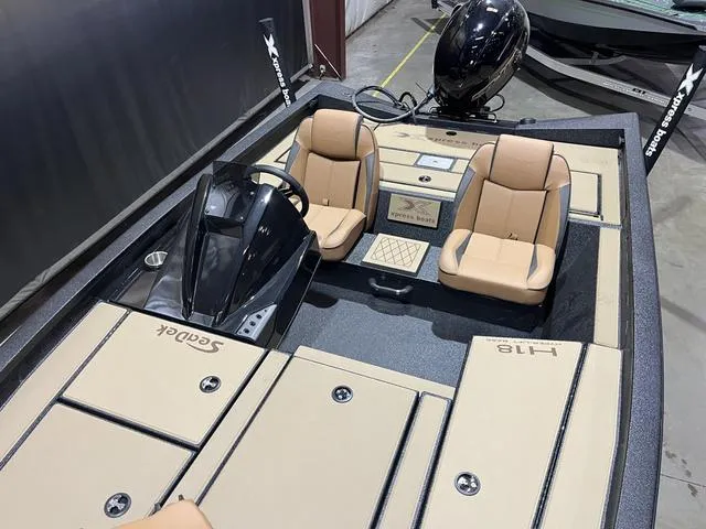 Slide: The Image of 2025 Xpress Hyper-Lift Bass H18 boat with Yamaha 115 SHO engine, featuring tan seats. - 11