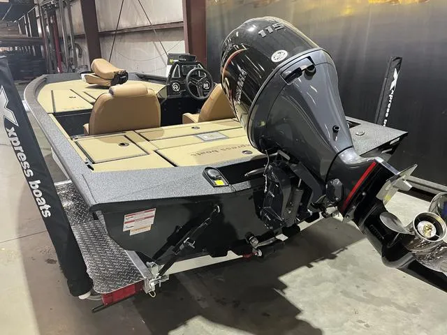 Slide: The Image of 2025 Xpress Hyper-Lift Bass H18 boat with Yamaha 115 SHO engine in a warehouse. - 7