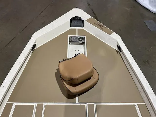 Slide: The Image of 2025 Xpress Hyper-Lift Bass H20 boat deck with tan seat and control panel. - 10