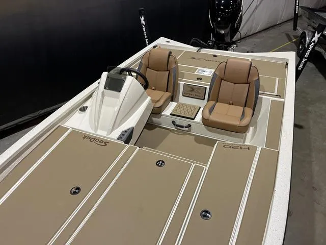 Slide: The Image of 2025 Xpress Hyper-Lift Bass H20 boat with Yamaha 175 "SHO" engine, featuring tan seating. - 12