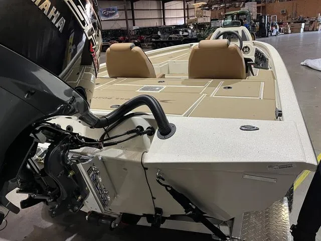 Slide: The Image of 2025 Xpress Hyper-Lift Bass H20 boat with Yamaha 175 SHO engine in a warehouse setting. - 5