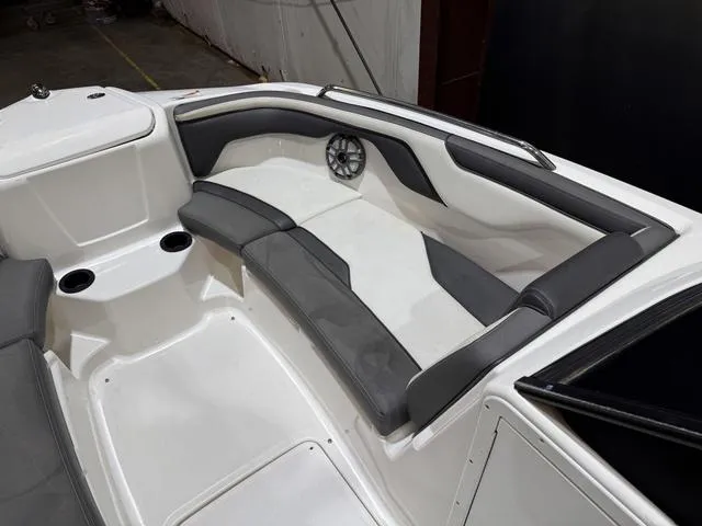 Slide: The Image of 2020 Yamaha AR210 boat interior with gray seating and cup holders. - 12