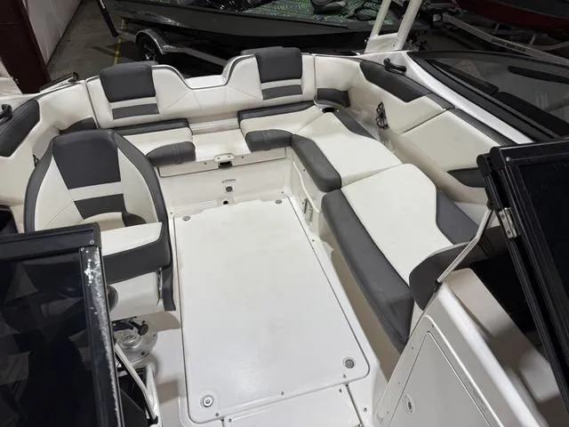 Slide: The Image of 2020 Yamaha Boats AR210 interior with spacious seating and modern design. - 17