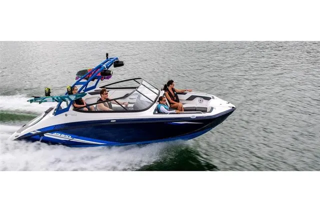 Slide: The Image of 2020 Yamaha AR210 boat cruising on water with passengers enjoying the ride. - 23