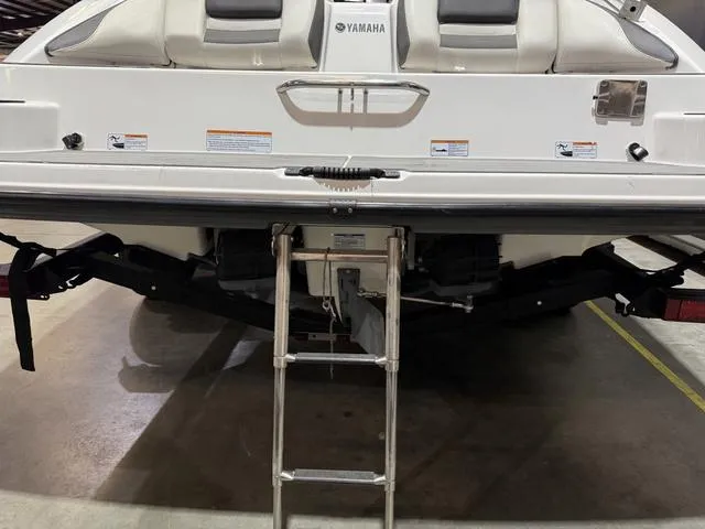 Slide: The Image of 2020 Yamaha AR210 boat rear view with ladder and seating. - 5