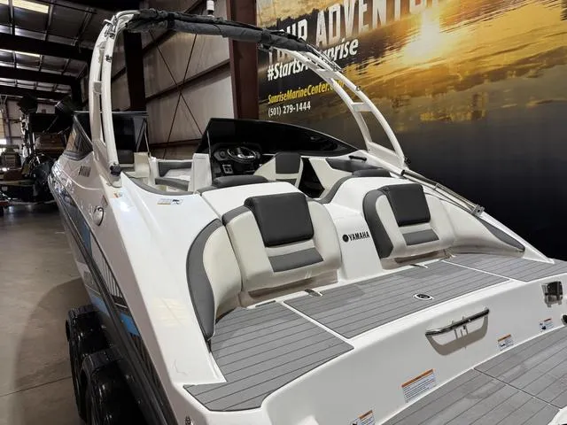 Slide: The Image of 2020 Yamaha AR210 boat in showroom, featuring sleek design and comfortable seating. - 8