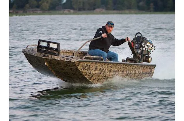 Slide: The Image of 2023 Excel Shallow Water F4 boat with Mud Buddy 40HDR engine on a lake. - 26