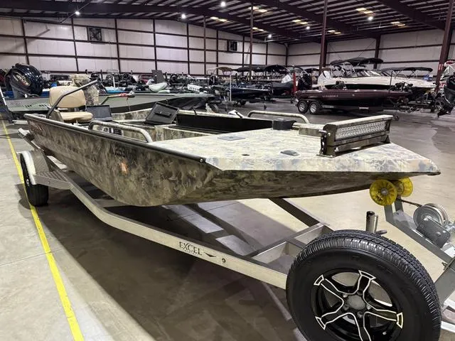 Slide: The Image of 2023 Excel Shallow Water F4 1860 boat with Mud Buddy 40HDR in showroom. - 3