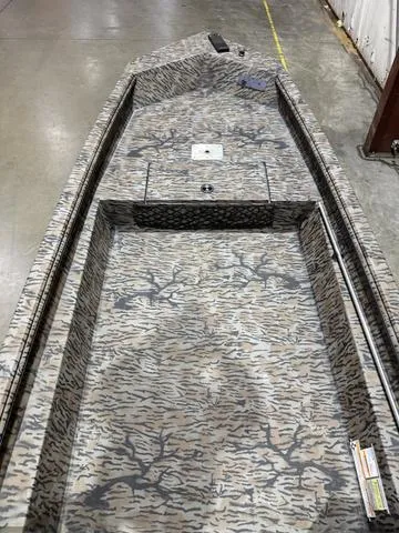 Slide: The Image of 2024 Xpress HD15DBX boat with Yamaha 40HP, featuring a camouflage interior design. - 6