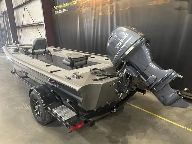 Slide: The Image of 2025 War Eagle 754VS boat with Yamaha 50 engine in showroom. - 4