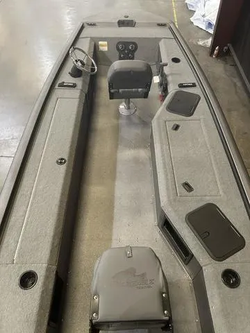 Slide: The Image of 2025 War Eagle 754VS boat interior with Yamaha 50, featuring seating and storage compartments. - 5