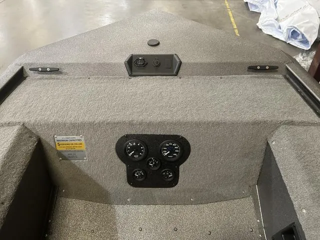 Slide: The Image of 2025 War Eagle 754VS boat dashboard with Yamaha 50 controls and gauges. - 6