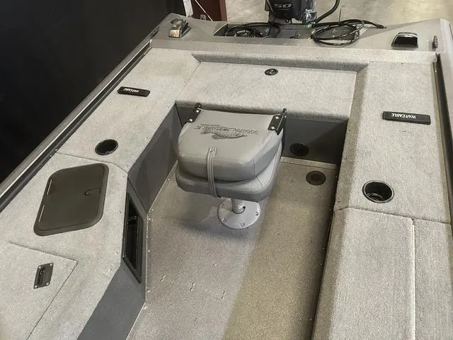 Slide: The Image of 2025 War Eagle 754VS boat interior with Yamaha 50, featuring seating and storage compartments. - 9