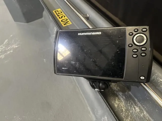 Slide: The Image of Fishfinder device on a 2024 Supreme L61 boat, featuring a Humminbird Helix 7. - 10