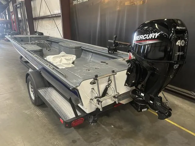 Slide: The Image of 2024 Supreme L61 boat with Mercury 60/40 Jet engine on trailer in warehouse. - 5