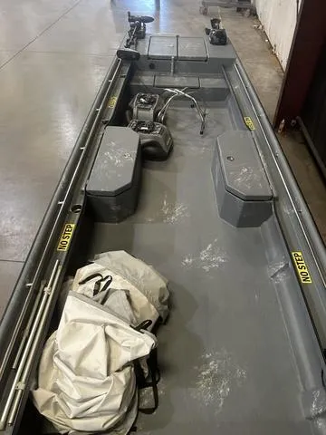 Slide: The Image of 2024 Supreme L61 boat with Mercury 60/40 Jet engine, interior view, in a garage. - 6