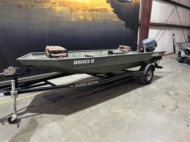 Slide: The Image of 2015 Alumacraft 1648 boat with Yamaha 25 motor on trailer in warehouse. - 3