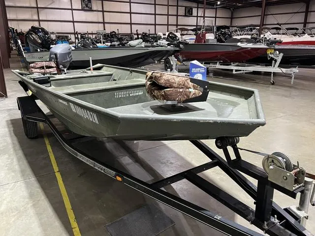 Slide: The Image of 2015 Alumacraft 1648 boat with Yamaha 25 engine on trailer in warehouse. - 4