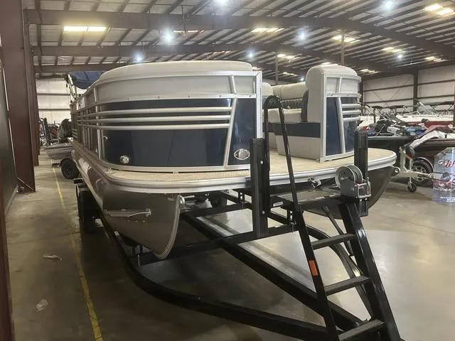 Slide: The Image of 2023 Nepallo Pontoons 22QL with Suzuki 90, displayed in a spacious indoor showroom. - 3