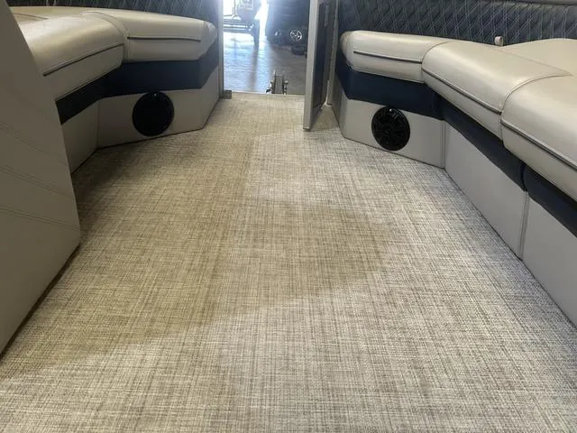 Slide: The Image of Interior of 2023 Nepallo Pontoons 20 TL with Suzuki 90, featuring plush seating and carpeted flooring. - 13