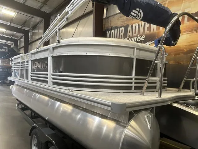 Slide: The Image of 2023 Nepallo Pontoons 20 TL with Suzuki 90, showcased indoors, highlighting sleek design. - 4