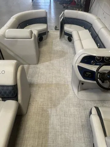 Slide: The Image of 2023 Nepallo Pontoons 20 TL interior with Suzuki 90, featuring spacious seating and modern dashboard. - 8