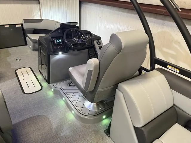 Slide: The Image of 2025 Veranda Relax VR22RCT boat interior with Yamaha 300, featuring modern seating and illuminated controls. - 11