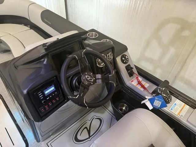 Slide: The Image of 2025 Veranda Relax VR22RCT boat interior with Yamaha 300, featuring steering console and seating. - 13
