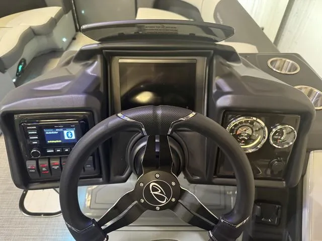 Slide: The Image of Steering console of 2025 Veranda Relax VR22RCT with Yamaha 300, featuring modern controls and gauges. - 14