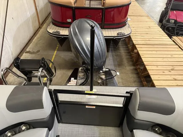 Slide: The Image of 2025 Veranda Relax VR22RCT with Yamaha 300 engine, docked indoors. - 21