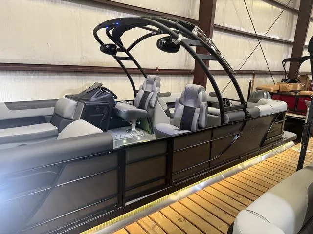 Slide: The Image of 2025 Veranda Relax VR22RCT pontoon boat with Yamaha 300, sleek design, indoor display. - 3