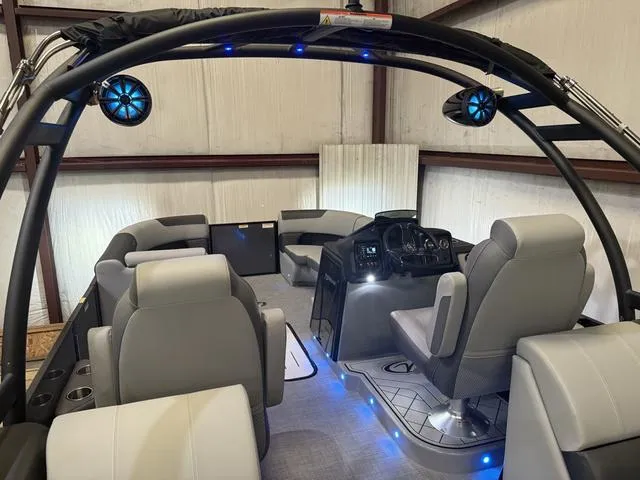 Slide: The Image of 2025 Veranda Relax VR22RCT pontoon boat interior with Yamaha 300, featuring modern seating and blue LED lighting. - 9