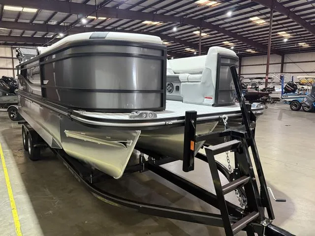 Slide: The Image of 2025 SunCatcher Select 322SS boat on trailer in indoor showroom. - 5