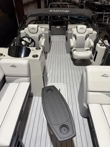 Slide: The Image of 2025 SunCatcher Select 322SS W/VF200XB pontoon boat interior with luxurious seating and sleek design. - 8
