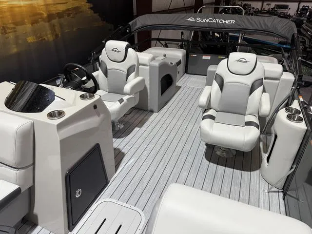 Slide: The Image of 2025 SunCatcher Select 322SS boat interior with modern seating and sleek design. - 9