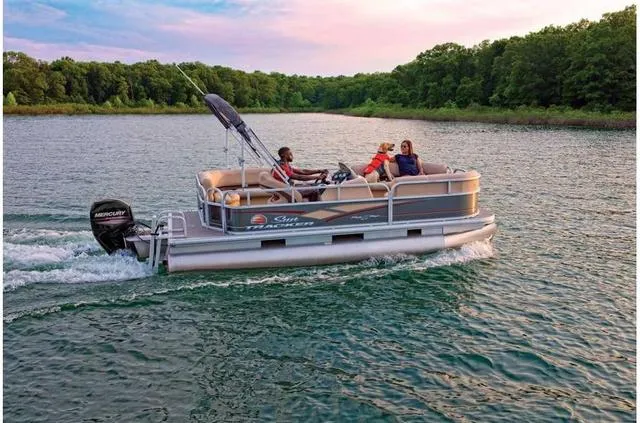 Slide: The Image of 2019 Sun Tracker PARTY BARGE 18 DLX on a serene lake at sunset. - 19