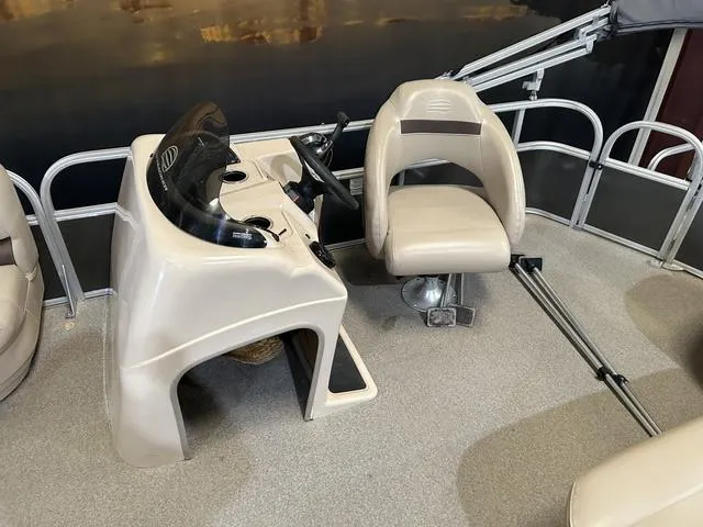 Slide: The Image of 2019 Sun Tracker PARTY BARGE 18 DLX boat interior with steering console and seat. - 7