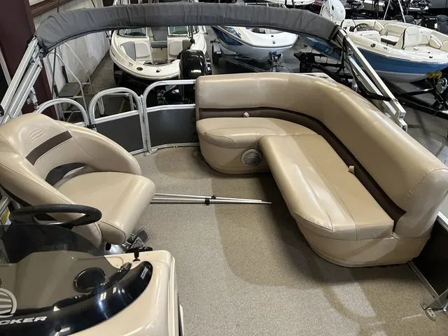 Slide: The Image of 2019 Sun Tracker PARTY BARGE 18 DLX interior with beige seating and Mercury 60 engine. - 8