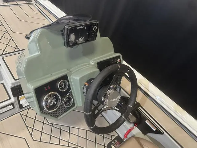Slide: The Image of 2025 Avid Vertex 18 boat dashboard with Yamaha 115 "SHO" controls and steering wheel. - 15