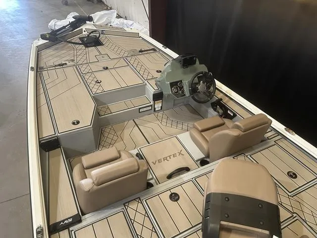 Slide: The Image of 2025 Avid Vertex 18 boat interior with Yamaha 115 "SHO" engine, featuring tan seating and deck. - 8