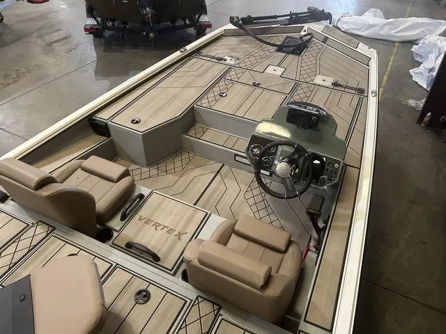 Slide: The Image of 2025 Avid Vertex 18 boat interior with Yamaha 115 "SHO" engine, featuring tan seating and steering console. - 9
