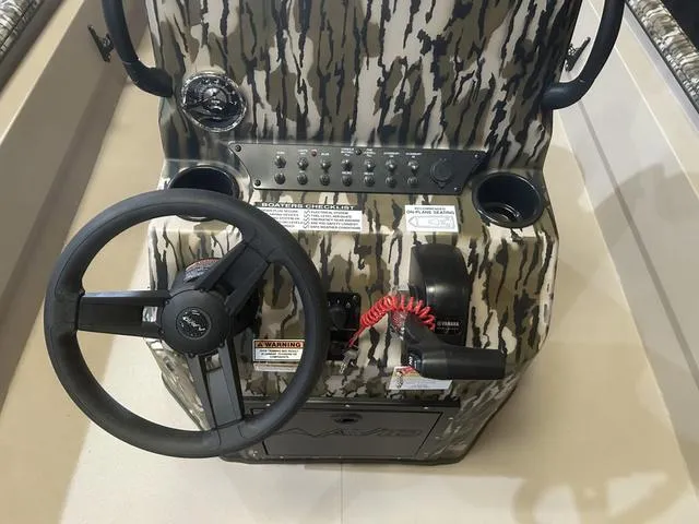 Slide: The Image of 2025 Avid Rogue 20 CC boat console with camo design and Yamaha 115 "SHO" controls. - 15